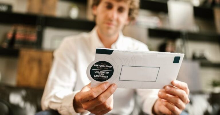 Benefits - Man in White Dress Shirt Holding White Envelope