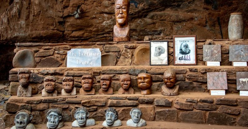 Theories - Head Carvings on a Clay and Stone Stairs