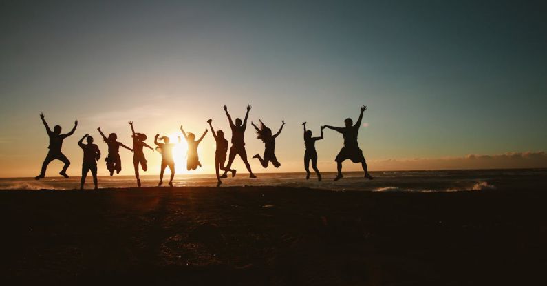 Team - Silhouette Photography of Group of People Jumping during Golden Time